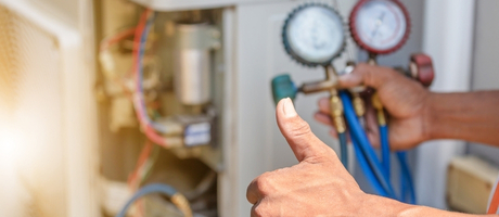 HVAC technicians installing furnace